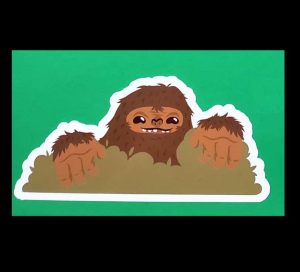 Cartoon Shaggy Brown Bigfoot Hiding Sticker