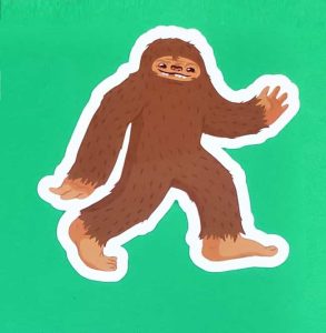 Cartoon Shaggy Brown Bigfoot Walking Sticker