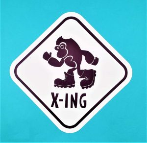 Black Cartoon Bigfoot Crossing Sticker