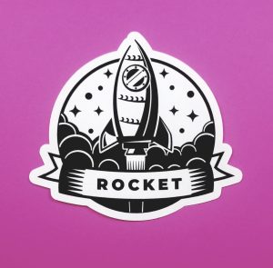 Round Rocket Black Space Emblem Sticker